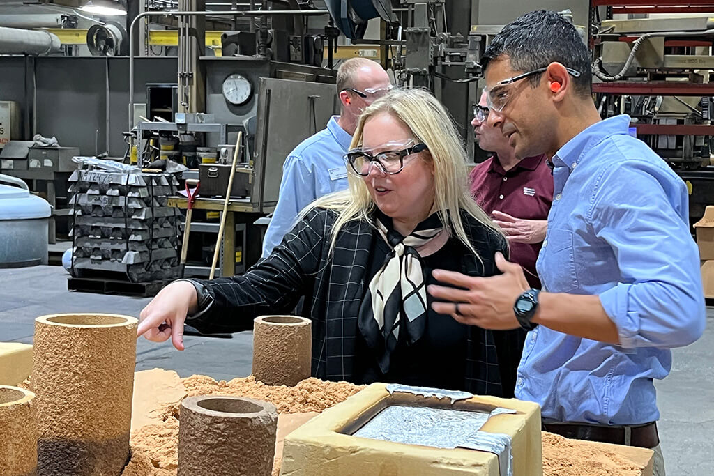 DWD Secretary-designee Amy Pechacek learns about the casting process from Wisconsin Aluminum Foundry CEO Sachin Shivaram.