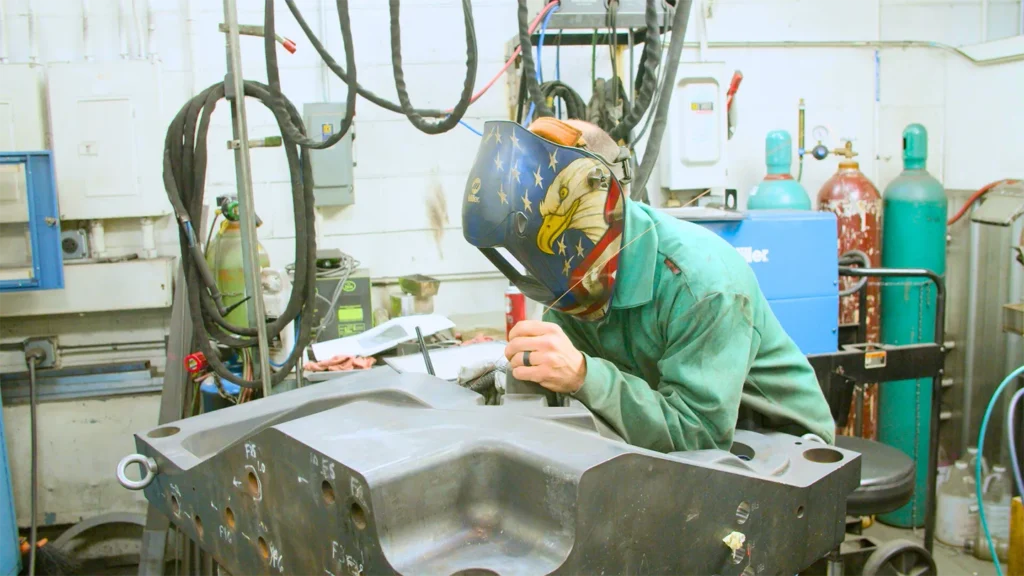Team member at Anderson Global working with protective gear