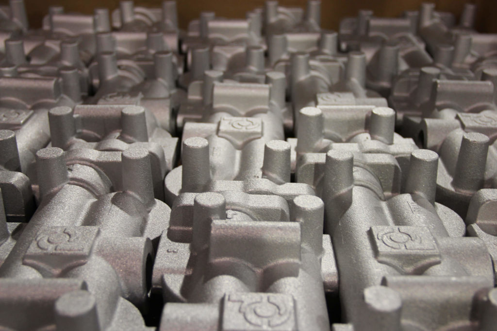 Top view of a table of uniform metal castings.