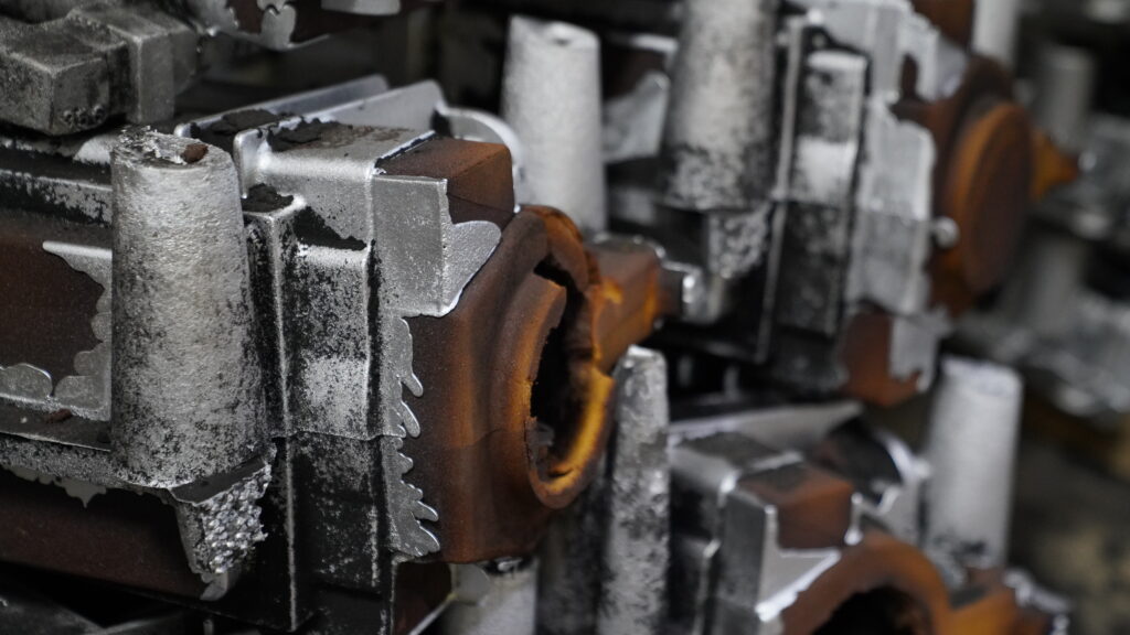 Close-up of Wisconsin Aluminum Foundry green sand cope and drag.