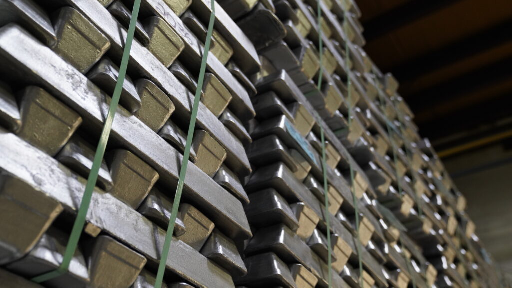 Close-up of uniform stack cast metal parts ready for shipping.
