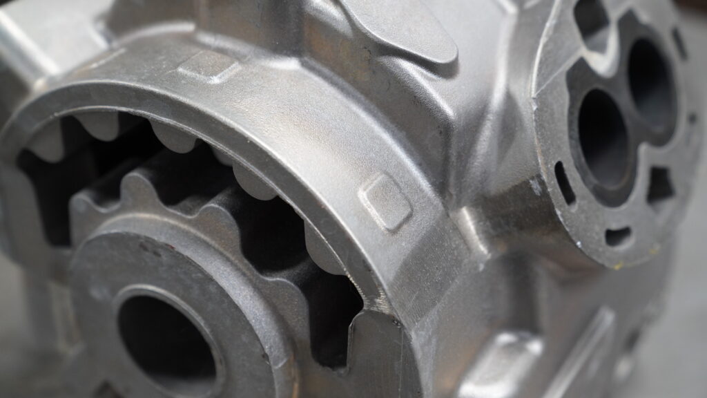 Side angle of an intricate Wisconsin Aluminum Foundry cast metal part.