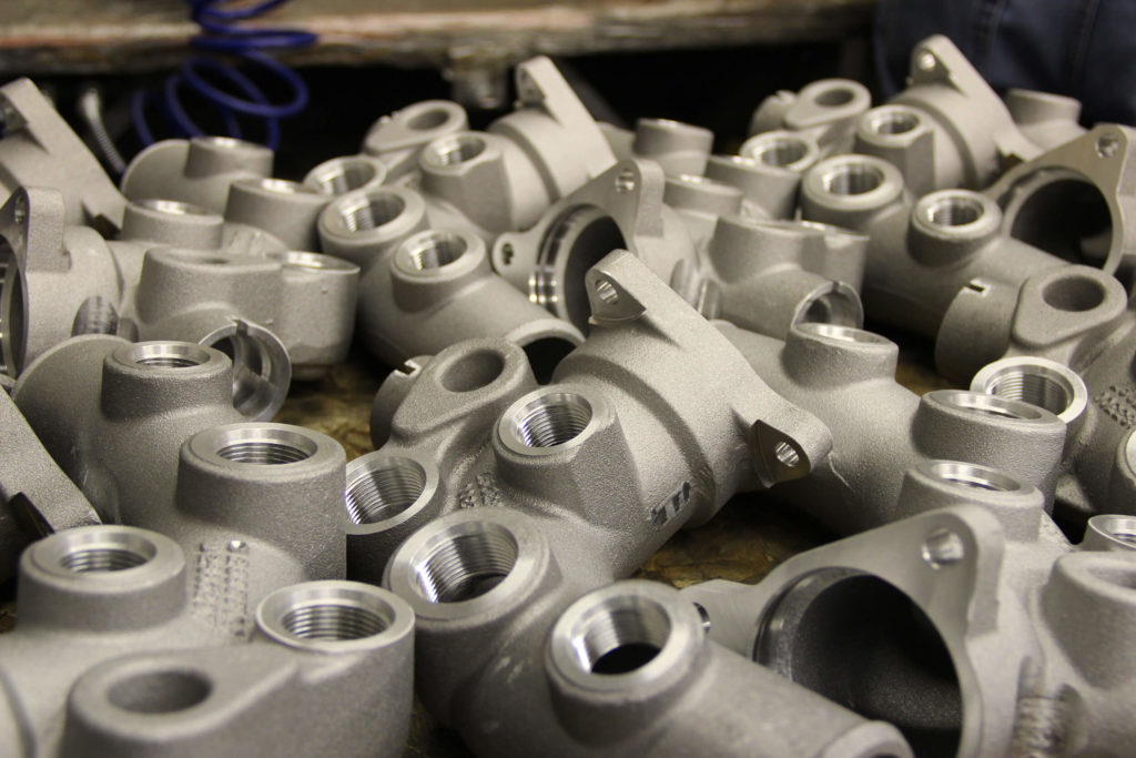 Table of uniform metal casting parts.