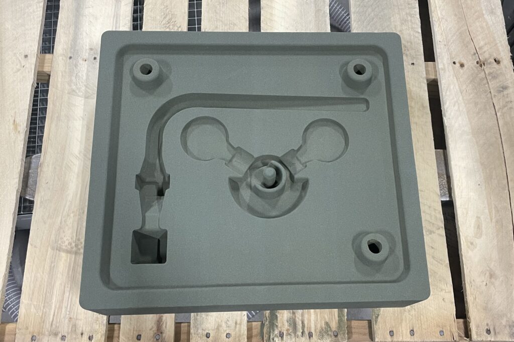 3D prototype rests on wooden pallet.