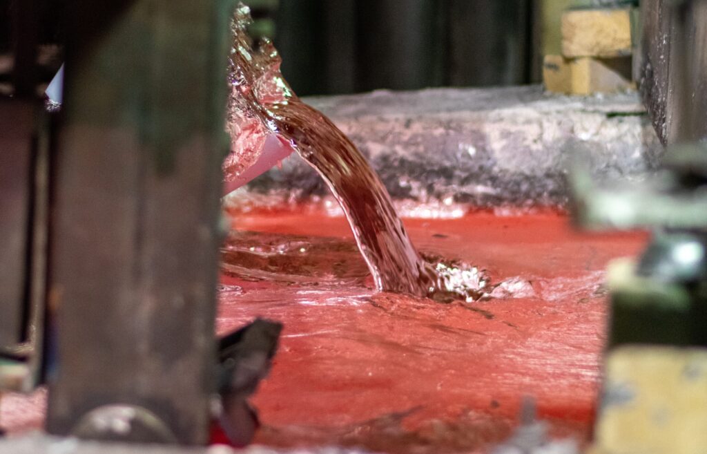 Wabash Castings, LLC, foundry closeup of aluminum being poured.